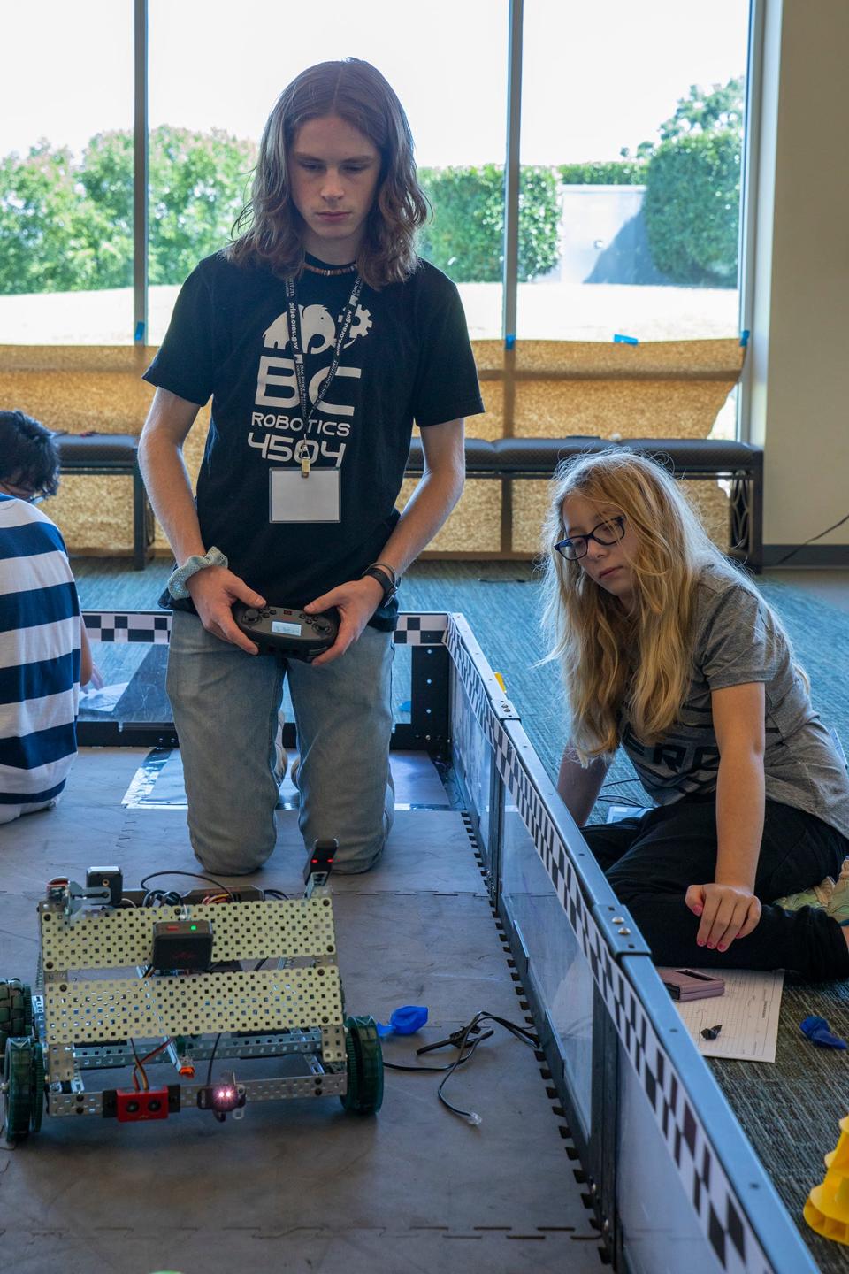 Gavin Good and Phoenix Tyner work together to program their robot. They went on to win the robot skills competition that capped off the ORISE Advanced Robotics Academy. For their victory, they received a sensor kit to enhance the robot tinker kits received by all academy participants.