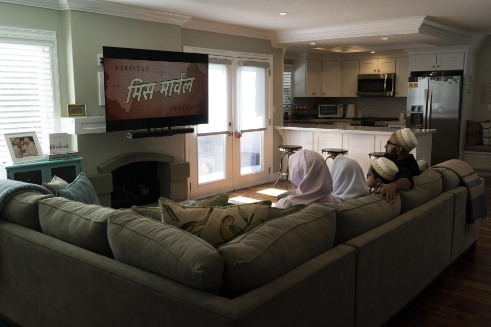 The Zakir family watch an episode of "Ms. Marvel" in Anaheim, Calif., Friday, July 8, 2022. The new Ms. Marvel series on Disney Plus has resonated with Muslims in the West. The show's refreshing approach to portraying the everyday lives of American Muslims has won many hearts. (AP Photo/Jae C. Hong)