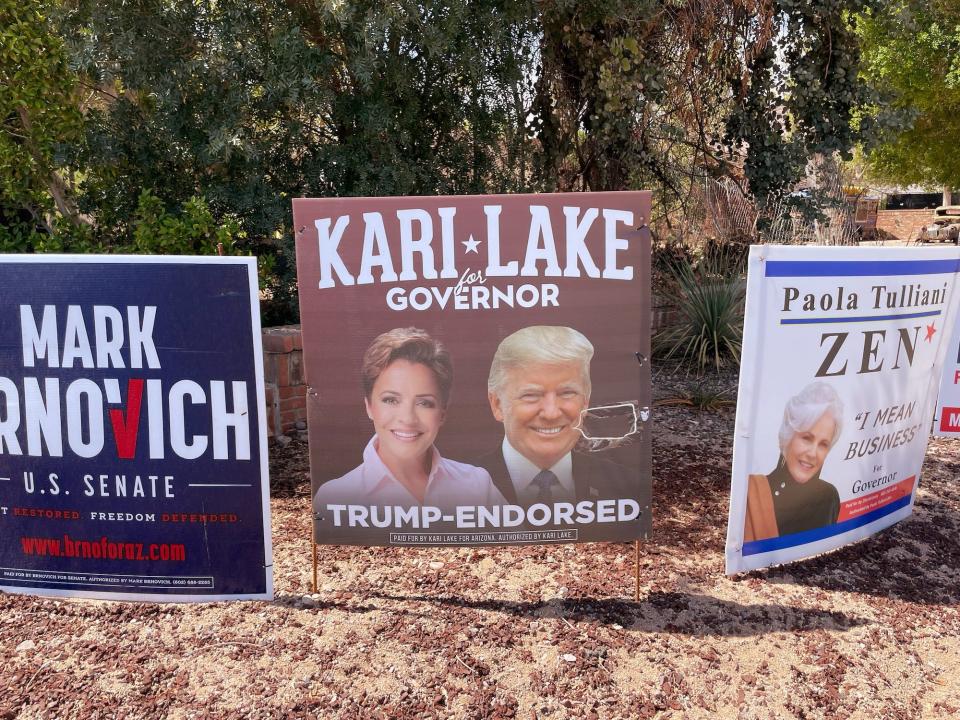 A yard sign for Kari Lake featuring the image of President Donald Trump in Phoenix, Arizona.