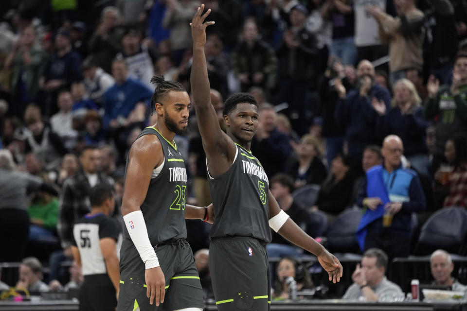 Minnesota Timberwolves guard Anthony Edwards (5) gestures to the crowd during the second half of the team's NBA basketball game against the San Antonio Spurs, Wednesday, Dec. 6, 2023, in Minneapolis. (AP Photo/Abbie Parr)