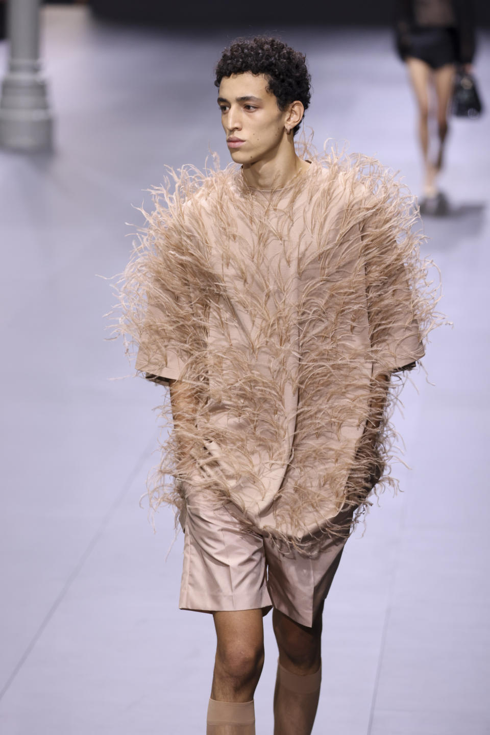 A model wears a creation for the Valentino ready-to-wear Spring/Summer 2023 fashion collection presented Sunday, Oct. 2, 2022 in Paris. (Photo by Vianney Le Caer/Invision/AP)