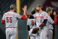 Cincinnati Reds relief pitcher Heath Hembree, left, greets right fielder Nick Castellanos after the team's 6-5 win in 12 innings in a baseball game against the Colorado Rockies on Saturday, May 15, 2021, in Denver. (AP Photo/David Zalubowski)