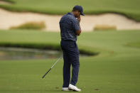 Tiger Woods reacts to his shot on the 13th hole during the first round of the PGA Championship golf tournament, Thursday, May 19, 2022, in Tulsa, Okla. (AP Photo/Eric Gay)