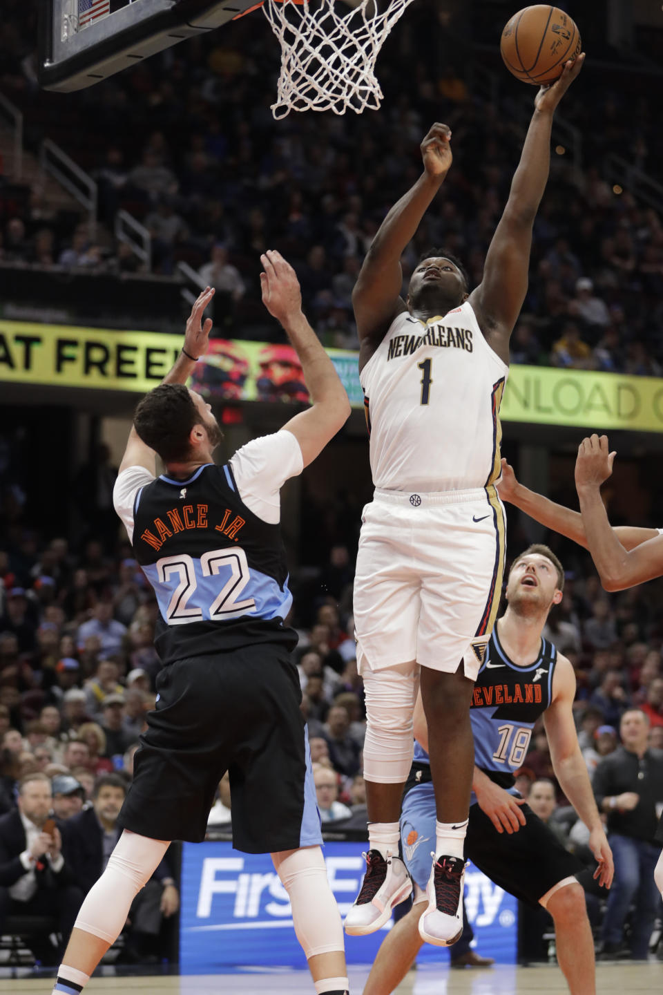 New Orleans Pelicans' Zion Williamson (1) shoots next to Cleveland Cavaliers' Larry Nance Jr. (22) during the second half of an NBA basketball game Tuesday, Jan. 28, 2020, in Cleveland. (AP Photo/Tony Dejak)