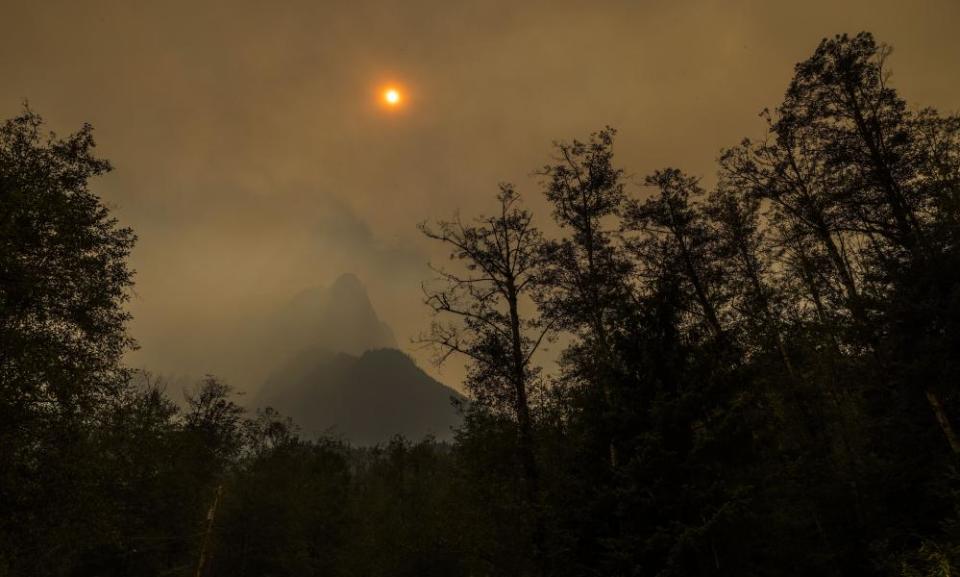 FILE - Mount Index is obscured by wildfire smoke from the Bolt Creek Fire Saturday, Sept. 10, 2022. The Puget Sound Clean Air Agency says wildfire smoke is making the air quality in downtown and North Seattle unhealthy for everyone. The Seattle Times reports the agency said Wednesday, Sept. 21, 2022, that wind sent smoke from the Bolt Creek fire near Skykomish west to Everett and south into parts of Seattle. (Daniel Kim/The Seattle Times via AP, File)