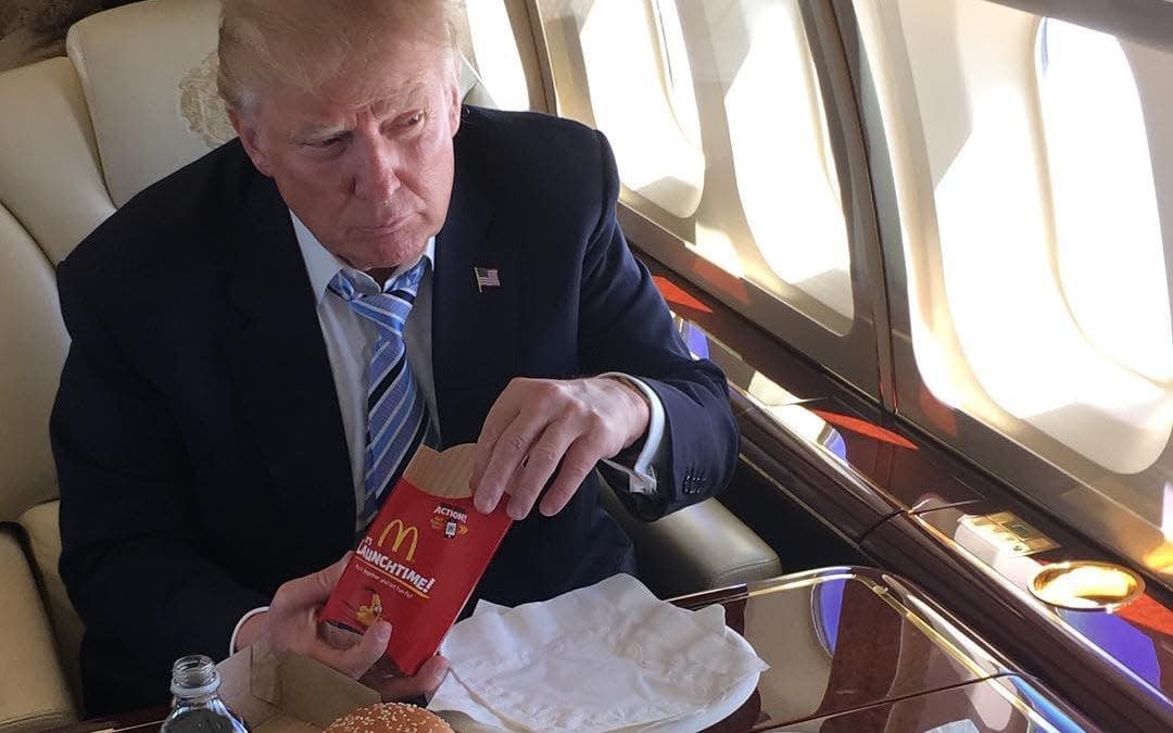 Donald Trump eats McDonald's on board a private jet during the campaign last year -  realdonaldtrump/Instagram