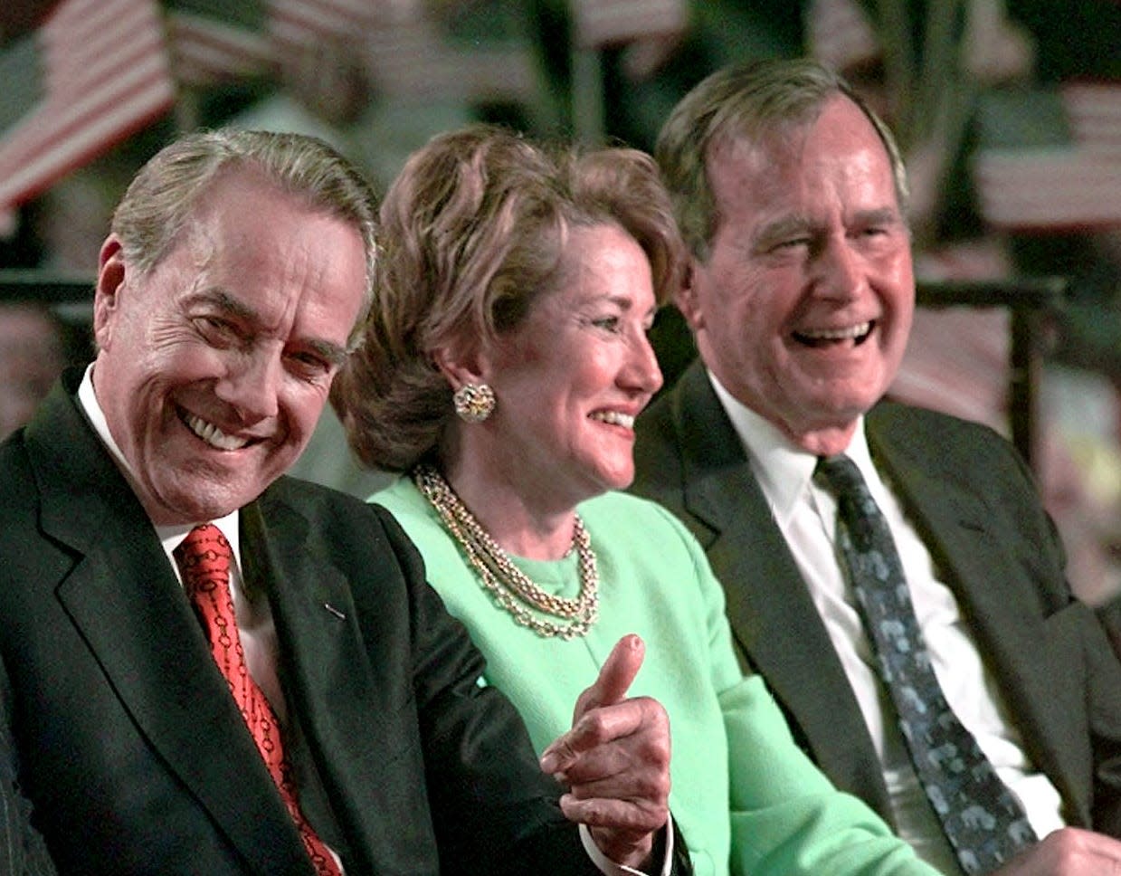 Bob and Elizabeth Dole with George H.W. Bush in Grand Rapids, Michigan, on Nov. 1, 1996.