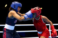 LONDON, ENGLAND - AUGUST 06: Marlen Esparza of the United States (Blue) competes against Karlha Magliocco (Red) of Venezuela during the Women's Fly (51kg) Boxing Quarterfinals on Day 10 of the London 2012 Olympic Games at ExCeL on August 6, 2012 in London, England. (Photo by Scott Heavey/Getty Images)