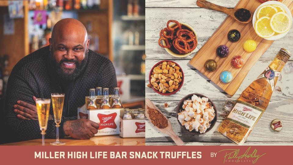 A bald man leaning over a table with iller High Life on it next to a photo of truffles and other food stuff used to made them place on a slab and in bowls