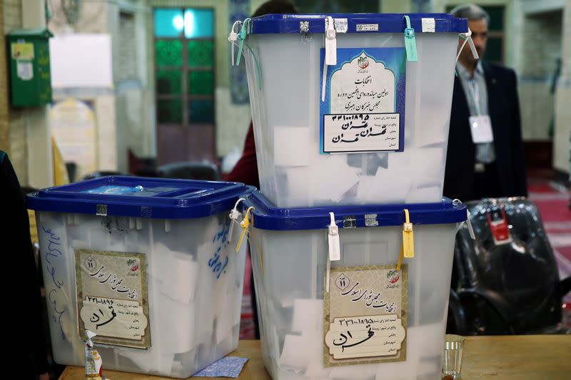 Full ballot boxes are pictured after the parliamentary election voting time ended in Tehran