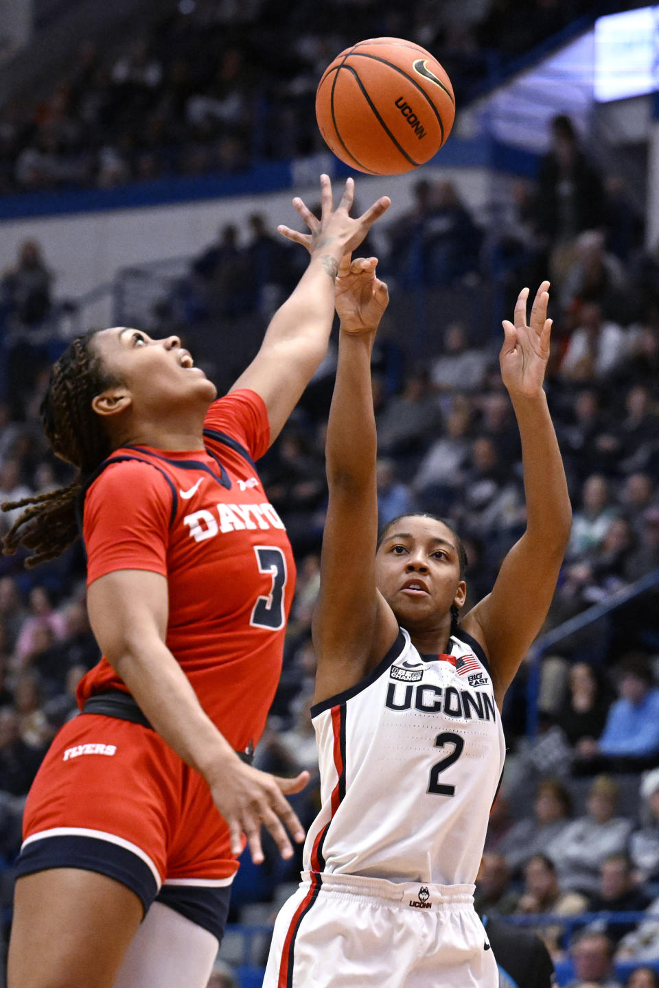 UConn guard KK Arnold (2) shoots over Dayton guard Anyssa Jones in the first half of an NCAA college basketball game, Wednesday, Nov. 8, 2023, in Storrs, Conn. (AP Photo/Jessica Hill)