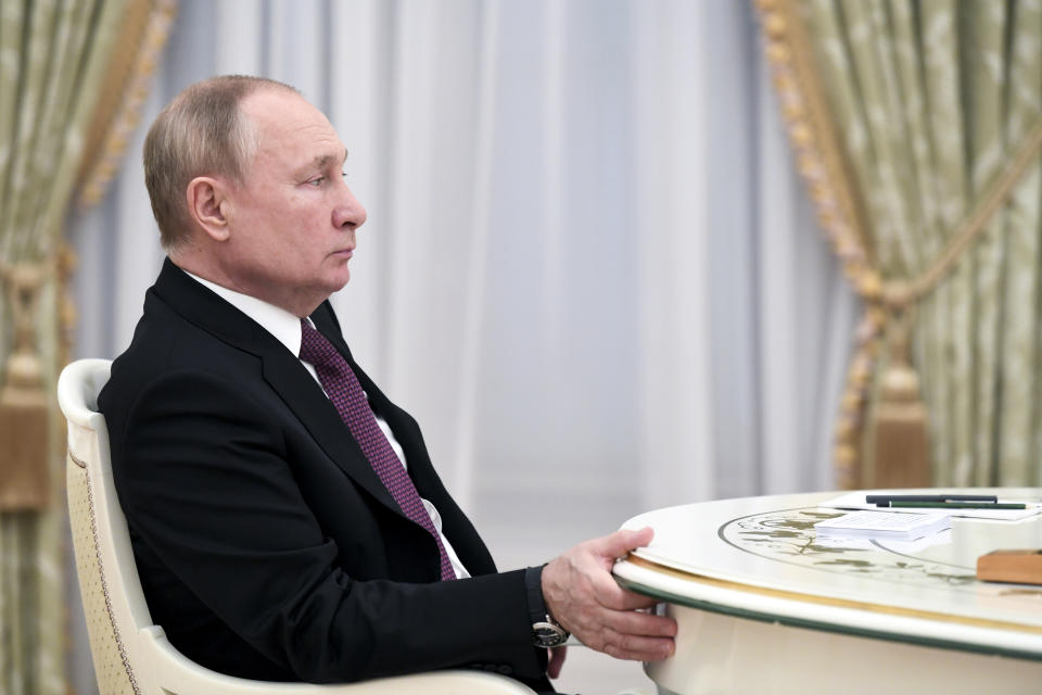 Russian President Vladimir Putin listens to Iranian President Ebrahim Raisi during their meeting at the Kremlin, in Moscow, Russia, Wednesday, Jan. 19, 2022. (Pavel Bednyakov/Sputnik, Kremlin Pool Photo via AP)