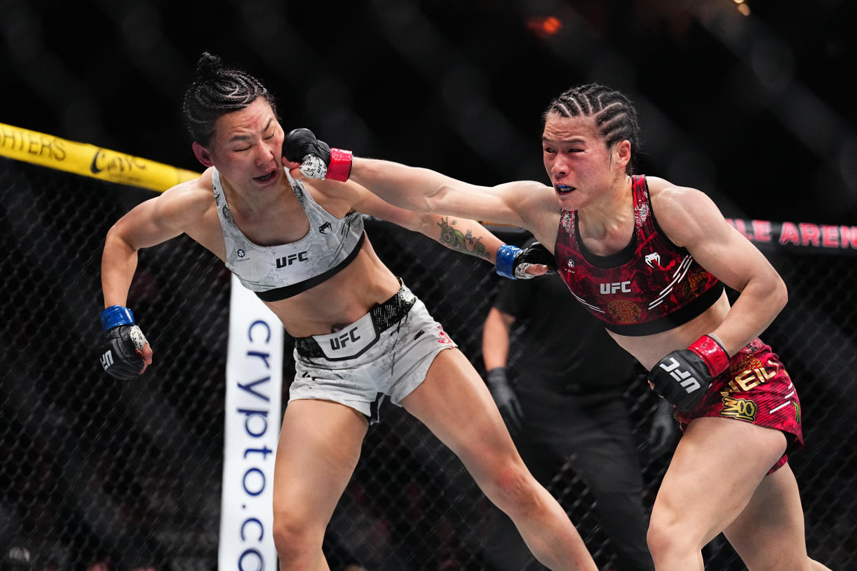 LAS VEGAS, NEVADA - APRIL 13: (R-L) Zhang Weili of China punches Yan Xiaonan of China in the UFC strawweight championship fight during the UFC 300 event at T-Mobile Arena on April 13, 2024 in Las Vegas, Nevada.  (Photo by Chris Unger/Zuffa LLC via Getty Images)