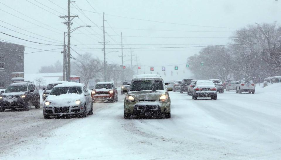 Traffic is backed up in the afternoon on Nicholasville Road at Southland Drive after Lexington received its first major snow of the winter season Jan. 6, 2022.