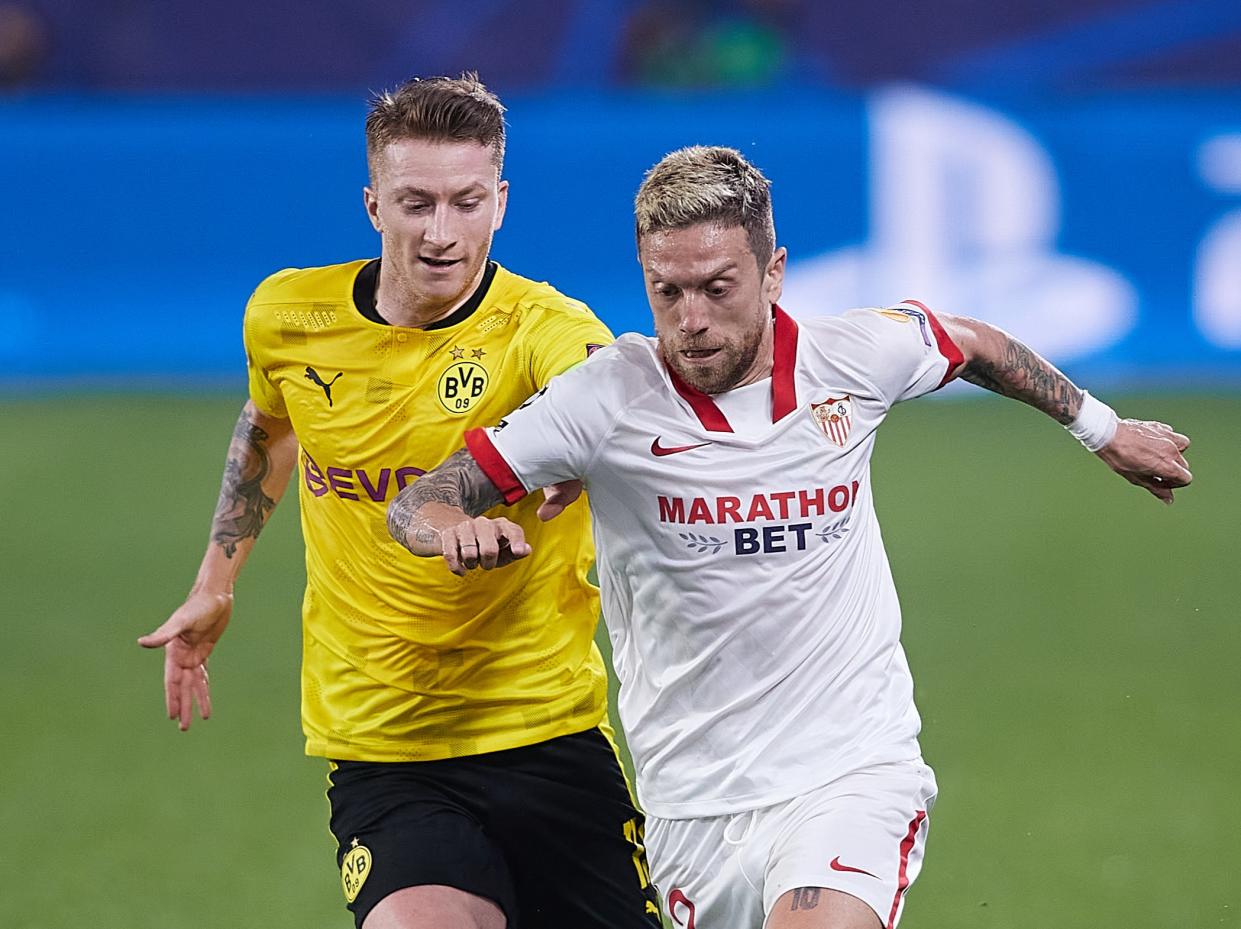 Alejandro Papu Gomez (left) of Sevilla vies for the ball with Borussia Dortmund’s Marco Reus (Getty Images)