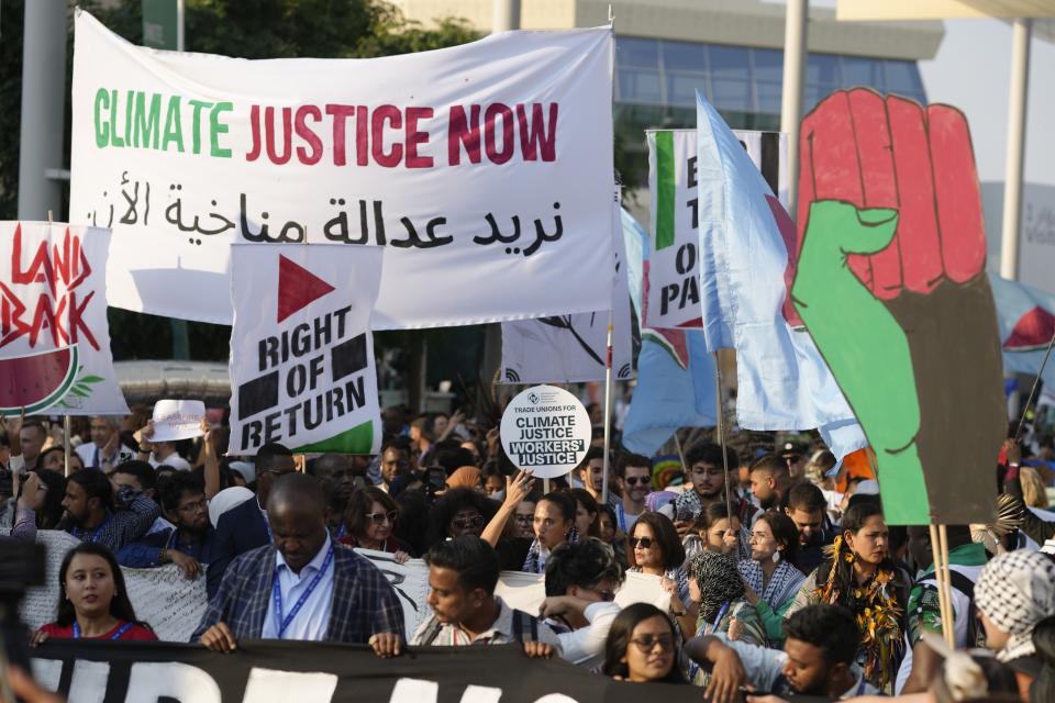 Activists demonstrate for climate justice and a ceasefire in the Israel-Hamas war at the COP28 U.N. Climate Summit, Saturday, Dec. 9, 2023, in Dubai, United Arab Emirates. (AP Photo/Peter Dejong)