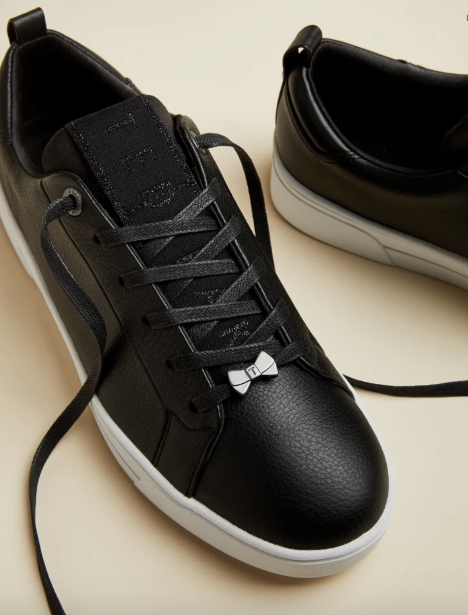 Branded leather trainers, £71 (was £119). PHOTO: Ted Baker