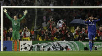 FILE - In this Wednesday May 21, 2008 file photo Manchester United's goalkeeper Edwin van der Sar, left, celebrates after making the winning save from Nicolas Anelka to win the Champions League final soccer match at the Luzhniki Stadium in Moscow. V is for Van der Sar. No player in history has ever had a longer gap between two Champions League successes than Edwin van der Sar, the former Netherlands international winning the trophy or the first time with Ajax in 1995 before again lifting the trophy as a Manchester United player 13 years later. (AP Photo/Ivan Sekretarev, File)