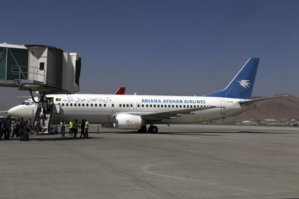 Passengers disembark as they arrive from Kandahar, at Hamid Karzai International Airport in Kabul, Afghanistan, Sunday, Sept. 5, 2021. Some domestic flights have resumed at Kabul's airport, with the state-run Ariana Afghan Airlines operating flights to three provinces. (AP Photo/Wali Sabawoon)