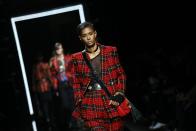 A model wears a creation for Balmain's Men fall-winter 2017-2018 fashion collection presented in Paris, Saturday, Jan. 21, 2017. (AP Photo/Francois Mori)