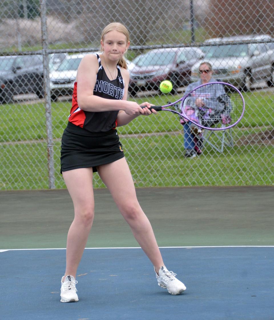 North Hagerstown's Lexi Sholes hits a backhand during a victory in the girls third doubles match against South Hagerstown.