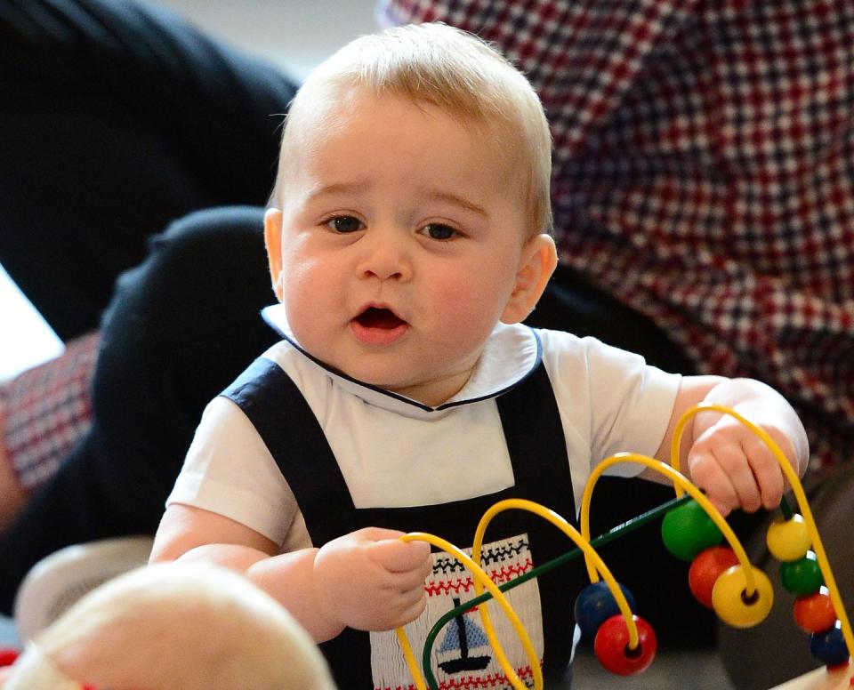 <p>George, 9 months, hams it up while attending a playgroup at Government House in Wellington, New Zealand. The visit was part of George, Kate, and William's official three-week tour of Australia and New Zealand.</p>