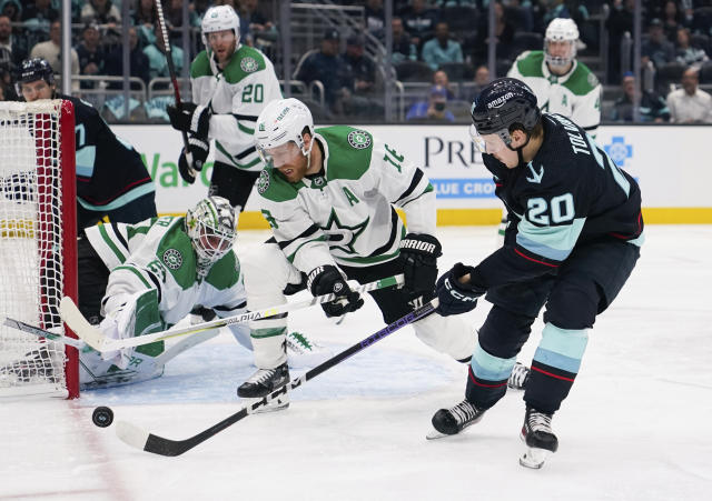 Dallas Stars center Joe Pavelski (16) blocks a shot from Seattle Kraken right wing Eeli Tolvanen (20) as goaltender Jake Oettinger (29) watches during the third period of Game 4 of an NHL hockey Stanley Cup second-round playoff series Tuesday, May 9, 2023, in Seattle. The Stars won 6-3. (AP Photo/Lindsey Wasson)