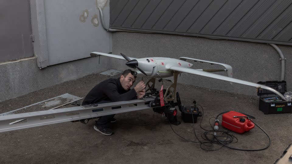 An employee works on a Raybird long-range surveillance drone at the Skyeton drone-manufacturing company in the Kyiv region on February 27. - Roman Pilipey/AFP/Getty Images