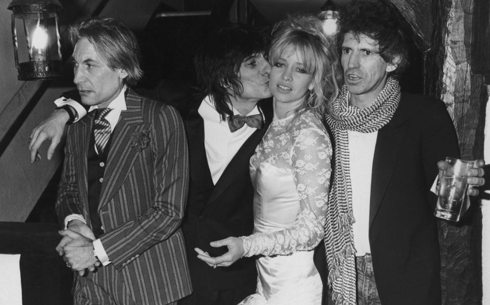 Jo and Ronnie celebrate their marriage in 1985, with Charlie Watts, left, and Keith Richards