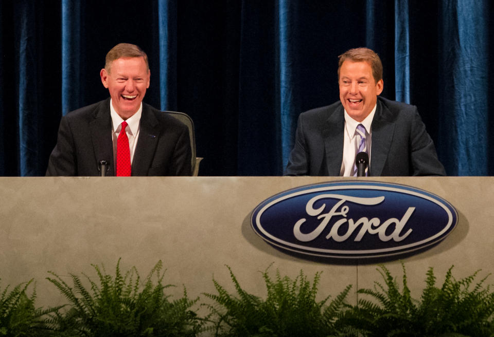 Executive Chairman for Ford Motor Company William Ford, right, and Ford President and CEO Alan Mulally, left, share a laugh during the company's annual shareholders meeting at the Hotel DuPont in Wilmington, Del., Thursday, May 10, 2012. Thursday's meeting lasted only 45 minutes, much of it spent with shareholders praising CEO Alan Mulally and Executive Chairman Bill Ford Jr. for the company's turnaround. (AP Photo/Ron Soliman)