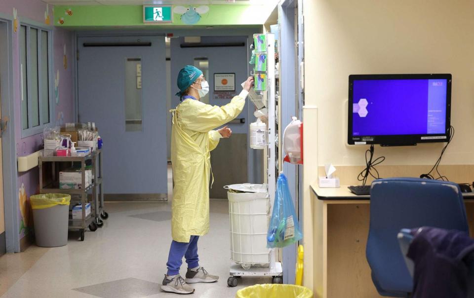 PHOTO: In this Dec. 15, 2022, file photo, a staff person works on the Critical Care Unit at The Hospital For Sick Kids in Toronto. Patients are filling hospitals as COVID, influenza and RSV hit children hard. (Steve Russell/Toronto Star via Getty Images, FILE)