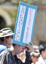 <p>A protester holds a sign near Alamo Square Park in San Francisco, Saturday, Aug. 26, 2017. (Photo: Josh Edelson/AP) </p>