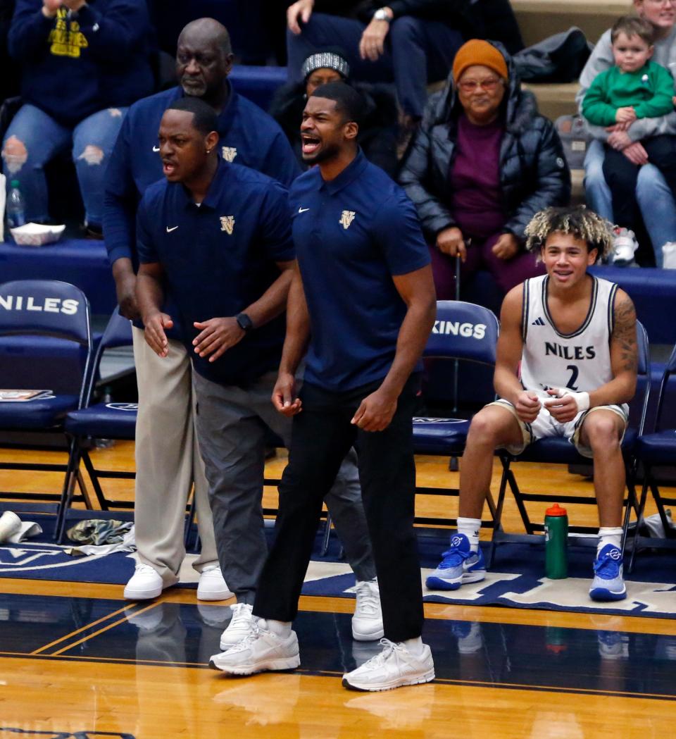 Niles head coach Myles Busby, center, reacts after his team scored during a boys basketball game against Edwardsburg Wednesday, Jan. 17, 2024, at Niles High School.