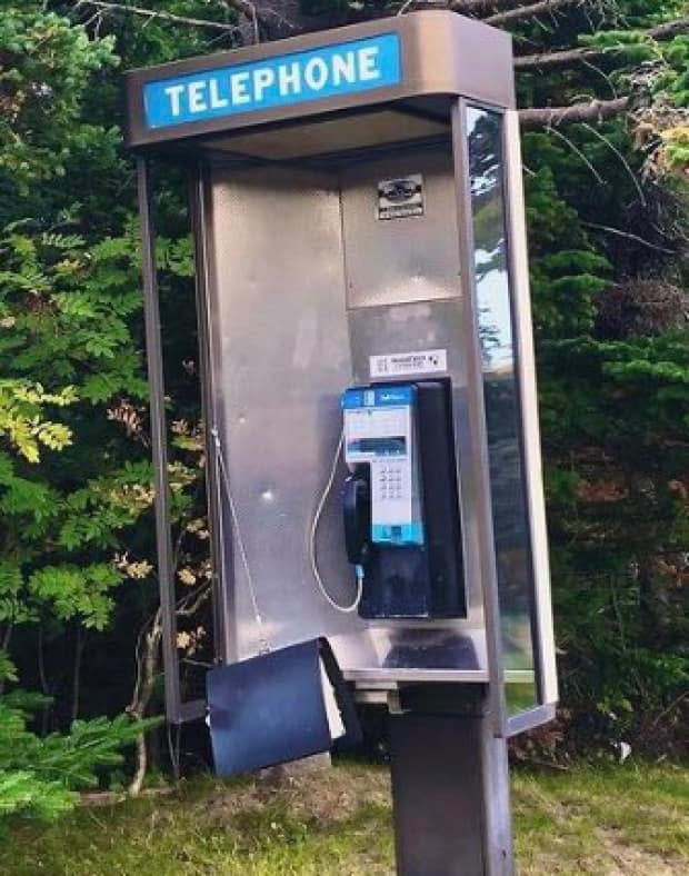 Payphones may be less noticeable in daily life, but some still exist in parts of Newfoundland and Labrador. (Shannon Reardon/Twitter - image credit)
