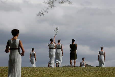 Olympics - Dress Rehearsal - Lighting Ceremony of the Olympic Flame Pyeongchang 2018 - Ancient Olympia, Olympia, Greece - October 23, 2017 Actors perform during the dress rehearsal for the Olympic flame lighting ceremony for the Pyeongchang 2018 Winter Olympic Games at the site of ancient Olympia in Greece REUTERS/Alkis Konstantinidis