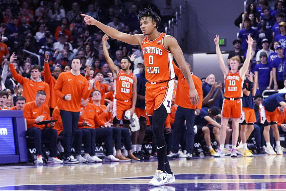 Illinois guard Terrence Shannon Jr., points to forward Marcus Domask after Damask hit a 3-pointer against Northwestern during the first half of an NCAA college basketball game in Evanston, Ill., Wednesday, Jan. 24, 2024. (AP Photo/Nam Y. Huh)