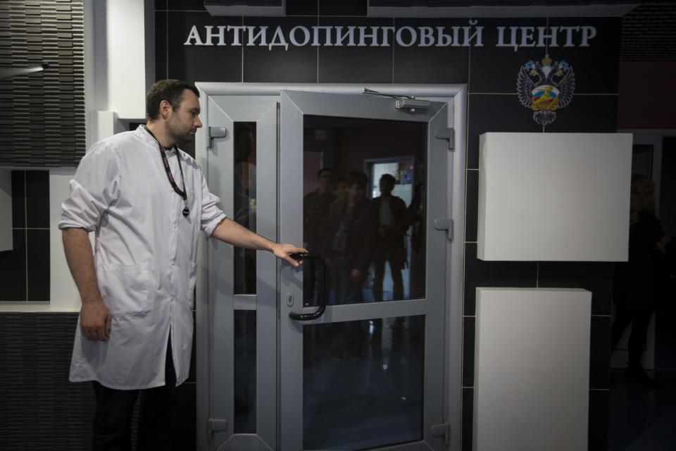 FILE - In this Tuesday, May 24, 2016 file photo, Grigory Dudko opens a door for journalists during a visit to Russia's national drug-testing laboratory in Moscow, Russia. Russia is accused of manipulating an archive of doping data from a laboratory in Moscow, which was meant to be a peace offering to the World Anti-Doping Agency to solve earlier disputes. (AP Photo/Alexander Zemlianichenko, File)