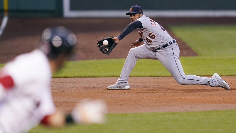 Detroit Tigers third baseman Jeimer Candelario (46) fields a grounder by Boston Red Sox designated hitter J.D. Martinez during the first inning of a baseball game at Fenway Park, Tuesday, May 4, 2021, in Boston. (AP Photo/Charles Krupa)