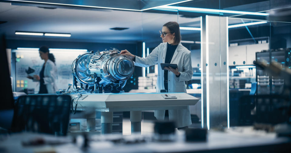 engineer working on a jet engine in a lab