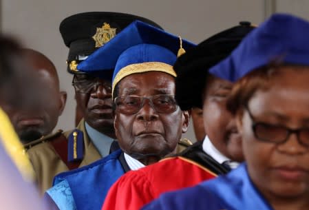 FILE PHOTO: Zimbabwe President Robert Mugabe attends a university graduation ceremony in Harare