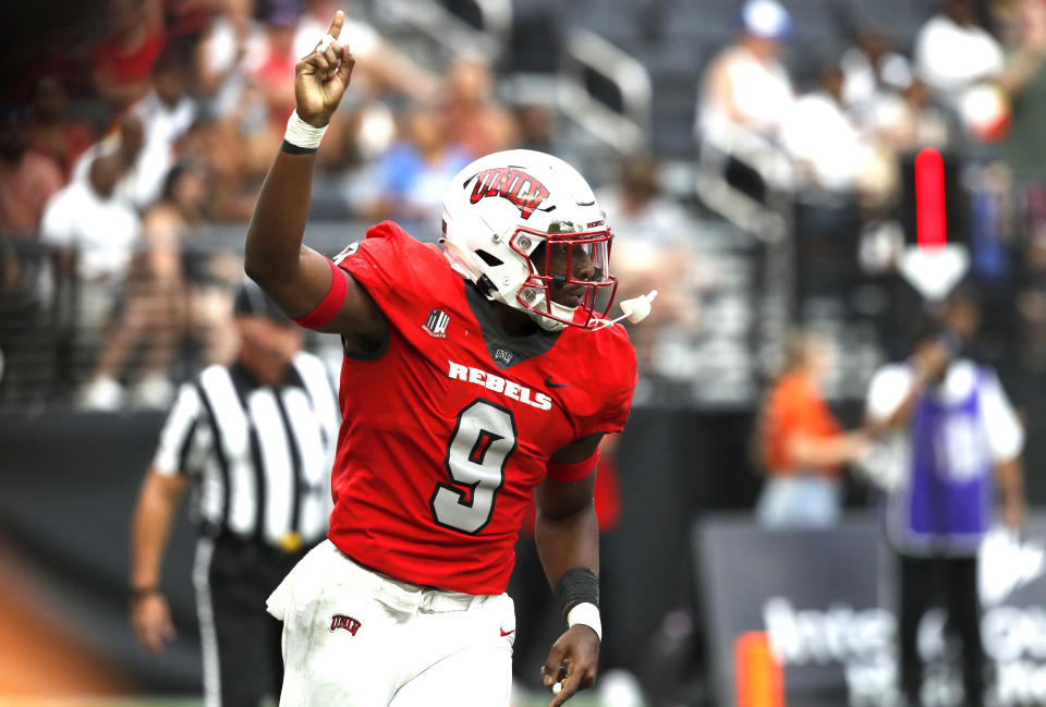 CORRECTS YEAR TO 2022 INSTEAD OF 2021 - UNLV running back Aidan Robbins (9) celebrates after scoring a touchdown during the first half of an NCAA college football game against Idaho State at Allegiant Stadium, Saturday, Aug. 27, 2022, in Las Vegas. (Steve Marcus/Las Vegas Sun via AP)