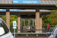 The Arlington Park Metra train station is seen near the shuttered Arlington International Racecourse in Arlington Heights, Ill., Friday, Oct. 14, 2022. The Chicago Bears want to turn the Arlington Heights site, once a jewel of thoroughbred racing, into a different kind of gem, anchored by an enclosed stadium and bursting with year-round activity — assuming a deal with Churchill Downs Inc. to buy the land goes through. (AP Photo/Nam Y. Huh)