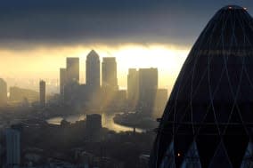 File photo dated 25/02/10 of the 'Gherkin' and Canary Wharf at sunrise in the City of London as the number of new jobs created in the City of London in January increased to 3,350, the highest for more than 18 months, according to a new report. PRESS ASSOCIATION Photo. Issue date: Monday February 3, 2014. Recruitment firm Astbury Marsden said the figure confirmed a strong trend of hiring in recent months. Chief operating officer Mark Cameron said: