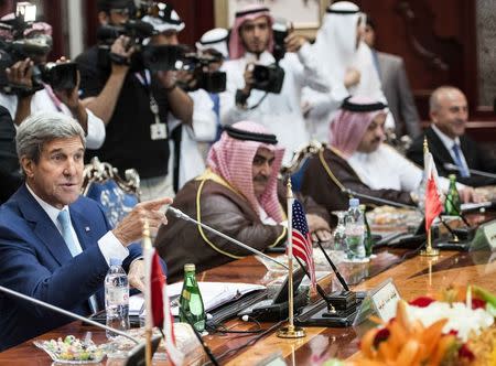 U.S. Secretary of State John Kerry talks with other attendees before the start of a Gulf Cooperation Council and Regional Partners meeting in Jeddah September 11, 2014. REUTERS/Brendan Smialowski/Pool