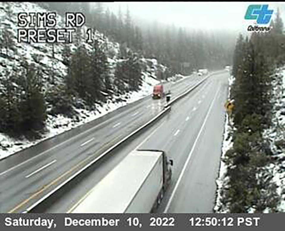 This image from a Caltrans traffic camera shows snow conditions on California Interstate 5 Sims Road in Shasta-Trinity National Forest, near Castella, Calif., on Saturday, Dec. 10, 2022. A stretch of California Highway 89 was closed due to heavy snow between Tahoe City and South Lake Tahoe, Cali., the highway patrol said. Interstate 80 between Reno and Sacramento remained open but chains were required on tires for most vehicles. (Caltrans via AP)