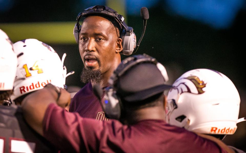 North Marion head coach Greg Carr talks to his team during a timeout last month when the Colts hosted the Belleview Rattlers.