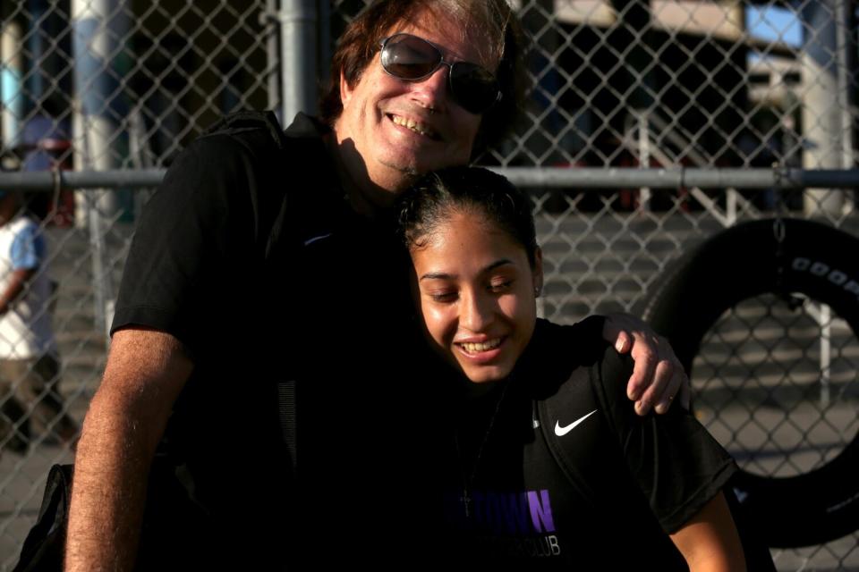 Nayelli Barahona receives a hug from her coach and mentor Mick Muhlfriedel