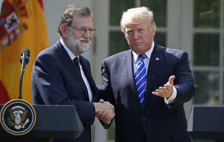 U.S. President Donald Trump gestures as he shakes hands with Spanish Prime Minister Mariano Rajoy as they conclude a joint news conference in the Rose Garden at the White House in Washington, U.S., September 26, 2017. REUTERS/Joshua Roberts