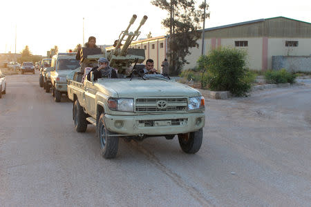 Military vehicles of members of the Libyan internationally recognised government forces head out from Misrata to front line in Tripoli, Misrata, Libya May 10, 2019. REUTERS/Ayman Al-Sahili