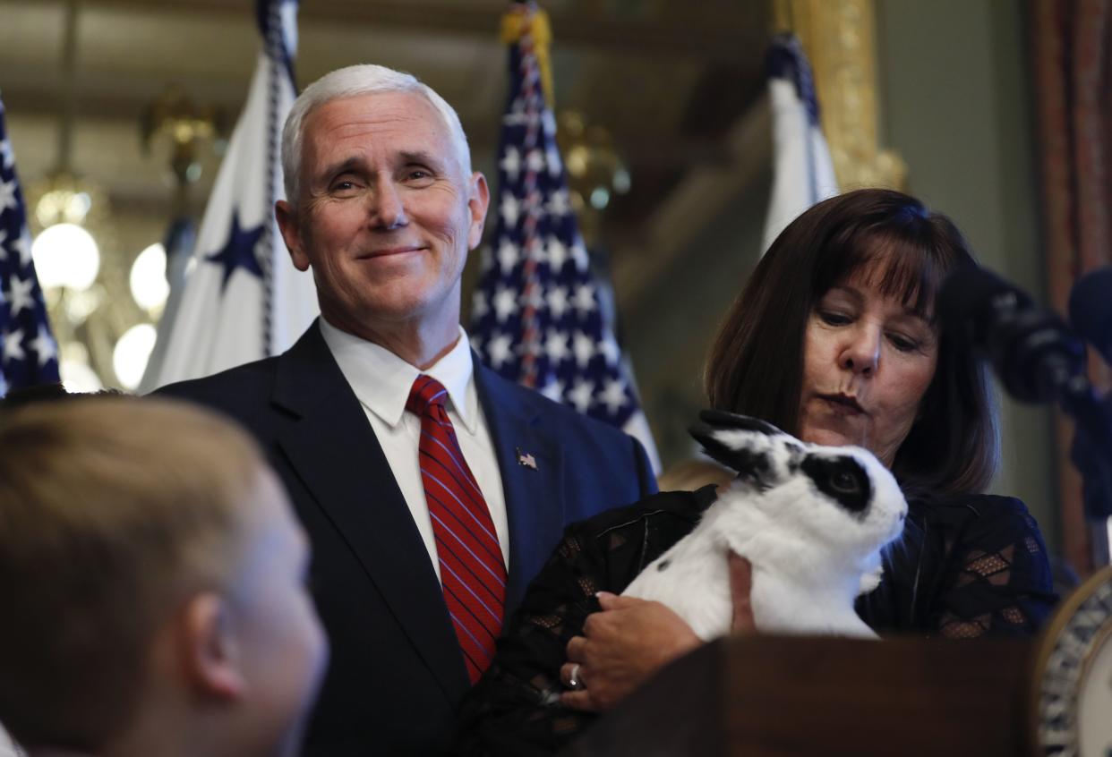 Former Vice President Mike Pence and his wife, Karen Pence holding their pet rabbit Marlon Bundo, arrive to speak in the Eisenhower Executive Office Building on the White House complex in Washington, Tuesday, May 9, 2017.